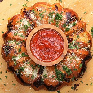 Flaky biscuit dough, marinara sauce, cheese, and pepperoni are baked together in a bundt pan, then you dig right in, with more marinara sauce for dipping! Recipe: https://tasty.co/recipe/pepperoni-pizza-monkey-bread | Tasty