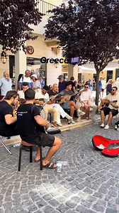 Where every corner feels like celebration 💙 Lost in the music, found in Greece — singing in the streets with locals and musicians, enjoying every second of this beautiful moment 😍 🎶🧡 #greekgetaway #greecemoments #enjoythemoment #greekmusic #traditional #greekspirit #enjoylife #greece | Greek Getaway