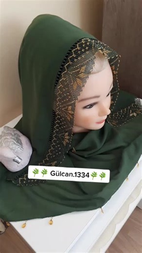 Intricate Gold Embroidery on Green Fabric Showcase