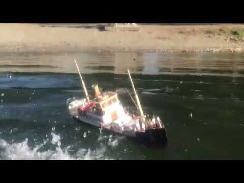 Small 1920s Cardboard Cargo ship sinks in high waves.