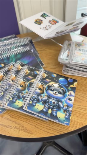 1.6K views · 39 reactions | Our sticker books are here! We had the larger size, but so many of you wanted a smaller one that fits better in a purse or a bag for traveling. These sizes are great for kids or perfect for a desk drawer! #stickers #stickerbook #reusablestickerbook | Fuzzy Loon Designs | Facebook