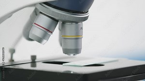 Using a high-tech microscope, scientists examine the sample in a modern industrial laboratory. Science and technology. Tests. Medical experiment.