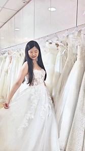 Oh, my gorgeous bride-to-be, this gown is the absolute dream! 🌸✨ The bodice is a stunning work of art with the most intricate floral lace that hugs you in all the right places—totally princess vibes. The delicate slit adds just the right amount of sass, giving you that perfect blend of sweet and sultry. You’ll feel like a fairytale come to life, all eyes on you as you glide down the aisle in this beauty. It’s the ultimate gown for a bride who’s ready to shine bright like the star she is! 🌟💖 #
