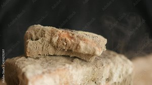 slice of bread falling on moldy bread, particles of mold slow motion, swirl, floating