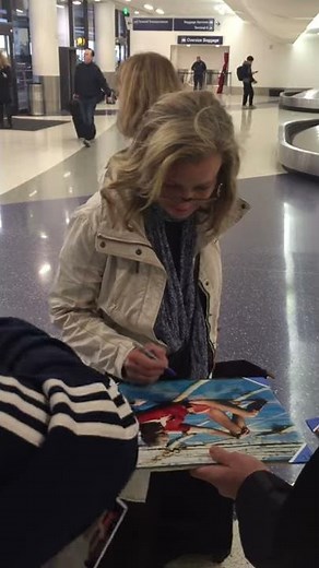 Bo Derek of 10 signing autographs