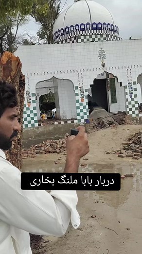 Building Demolition Process with Excavator Machinery