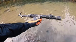 Rifles, a helmet and a surprising replica MP40 recovered from an Eastern Front lake