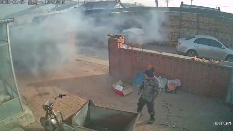 Clumsy dad kicks lit firecracker into whole stash and sets them all off in fiery chaos