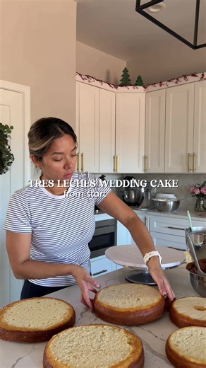 A tres leches with dulce de leche three tier wedding cake🥂🥛🍰 Dont over soak your cake layers that way you can stack the tiers without the cake breaking or falling apart🤍 #weddingcake #treslechesrecipe #caketok #cakedecorating #behindthescenes