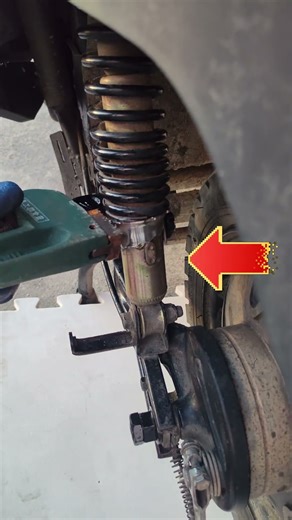 Motorcycle shock absorber adjustment is easy with an adjustable wrench