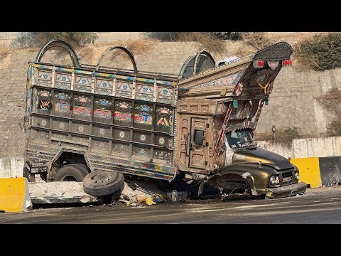 Out of Control! Heavy Pakistani Truck Crushed Against Road Barrier