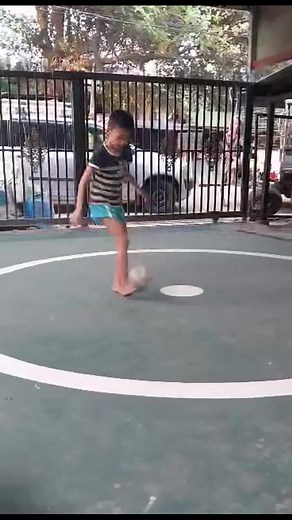 Children Playing Soccer in Outdoor Setting