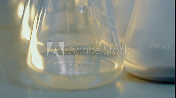 Laboratory Measurement, Close-up of laboratory flasks with measurement markings. Filtration of the substance in the laboratory