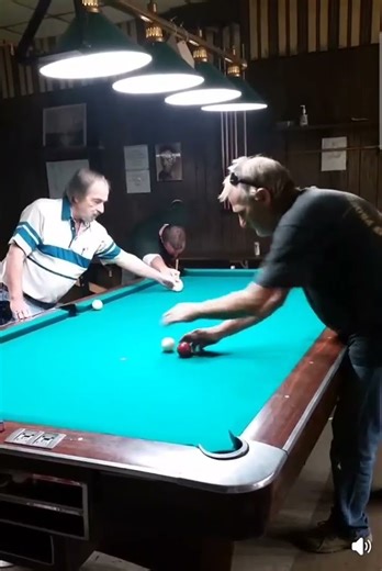 Pool skill shot. No vision is required if your stroke and cue don't waiver.