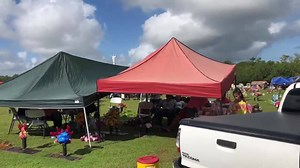Family and friends spend time with deceased loved ones as they celebrate All Souls Day at the Guam Memorial Park in Leyang, Barrigada. | Pacific Daily News