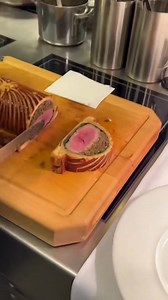 Beef Wellington 🏴󠁧󠁢󠁥󠁮󠁧󠁿at Bozar Restaurant Explore England: www.tasteatlas.com/england Beef Wellington is a classic dish featuring beef tenderloin coated in pâté and duxelles, wrapped in puff pastry, and baked to perfection. Traditionally served with Madeira sauce, it’s a symbol of elegance and precision in cooking. Though named after Arthur Wellesley, the first Duke of Wellington, its exact origins remain unclear. This iconic dish gained immense popularity in the 1960s, especially in Nor