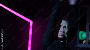 Live camera. Dancing woman in a choreographic hall with neon lighting. Close-up of the active waving of arms and gestures while performing the Waacking dance Stock Video