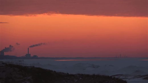 Stunning Orange Sunset Lights Up Frozen Lake Michigan