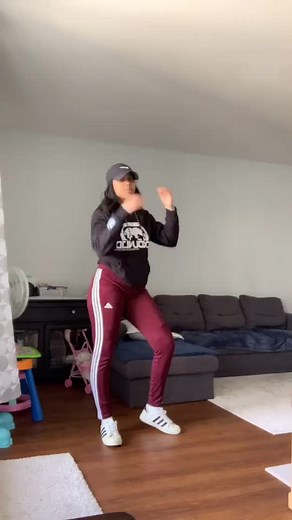 Energetic Dance Moves in a Cozy Living Room Setting