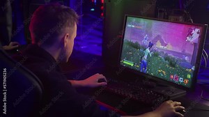 Gamer Focuses On Screen To Control Character In Digital Entertainment World. Gunfire. Gamer Competes In Digital Entertainment Battle Royale. Gamer Enjoys Video Game. Digital Entertainment Animation