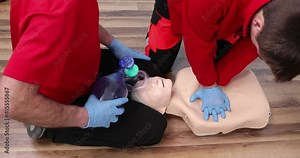 First aid training. Two medics train on courses. Reanimation with artificial ventilation . First Aid Cardiopulmonary Resuscitation, How to do the CPR