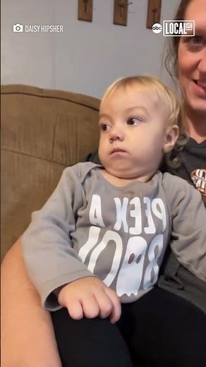 Baby not amused by mom's Lorax costume