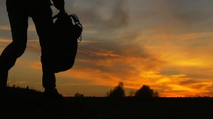 Stock Video Man With Backpack And Laptop At Sunse Animated Wallpaper