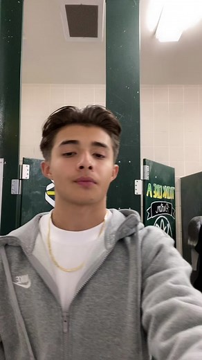 Young Male in Locker Room: Nike Style and Energy