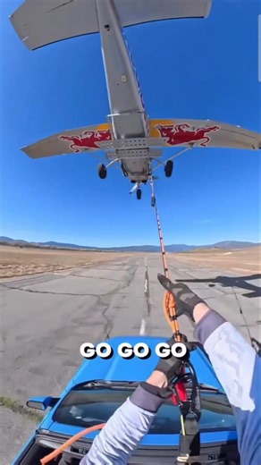 POV: Catching a Red Bull plane at 100 mph! #shorts #redbullteam #extreme