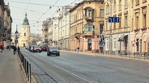 Download Ukraine. Lviv. 01.04.2021 Streets of the old Jewish city of Lviv. Morning time, people and cars moving through the city streets.