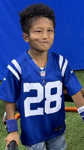 A young Indianapolis Colts fan attending his first game shared a special moment with his mom on the field as they met a cheerleader who knows ASL. | WTHR-TV