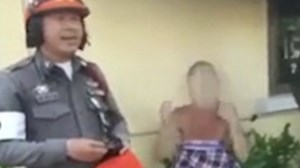 Female backpacker clothed by police after being found naked