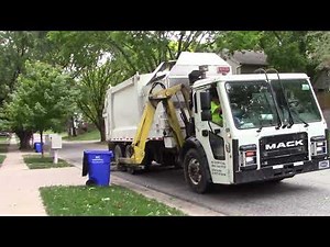 Heil Side Load White Garbage Truck In Action