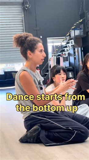 Gina Michael on Instagram: "It all starts from the ground up 👟💪🏽 Understanding and strengthening your base is key — a solid foundation allows your upper body to move freely and powerfully. P.s shoutout to my girl Evieee in the back, 10 years old and taking my advanced classes. This new gen is killing meeee!💪🏽 #dance #class #training #groundup #movement"