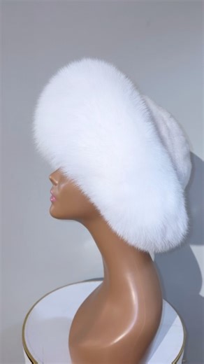 Hat hauture! The ultimate in glamour! A white mink crown is trimmed by a large brim of rich white fox for a polished and sophisticated look that will turn heads! Wear it with a matching mink or fox coat, your favorite winter suit or to top off a flowing cape. Add a bit of dash and drama with this lovely fur hat! | Bella Wayne Couture Boutique