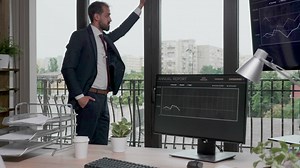 Business man in suit thinking and looking out window - Free Stock Video