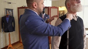 Tailor measuring client for custom made garment