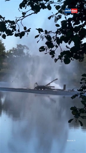A helicopter fighting a forest fire in France crashed into a lake while attempting to scoop water, after dropping too quickly and submerging its tail. Both men on board escaped safely and reached the shore unharmed. Authorities said the chopper had already completed 27 water drops before the accident. #France #HelicopterCrash #ForestFire #Firefighting | MiD DAY