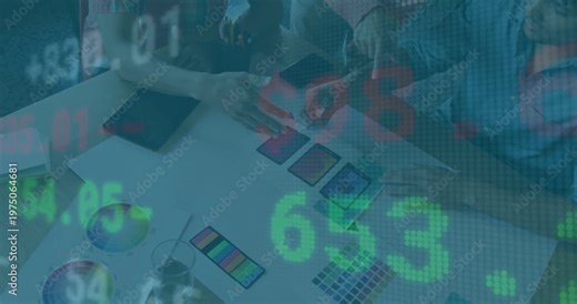 Design team triggered by live ticker examining and aligning swatches, finalizing palette on tablet