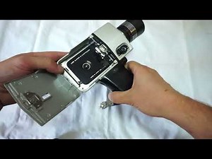 Hanimex MP 303 loading Super 8 film and batteries on Super 8 camera Hanimex MP 303 Loadmatic