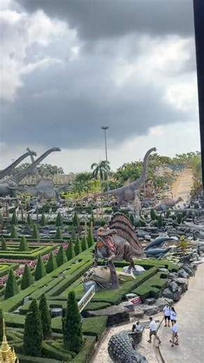 @nenastiiye embracing the enchanting allure of Nong Nooch Garden in Thailand 🌺 Nong Nooch Garden is a sprawling botanical garden located in the Chonburi Province of Thailand, approximately 15 kilometers southeast of Pattaya. It is renowned for its vast and meticulously landscaped grounds, which span over 500 acres (approximately 202 hectares). The garden features meticulously landscaped areas inspired by different cultures and themes, such as French gardens, European Renaissance gardens, and tr