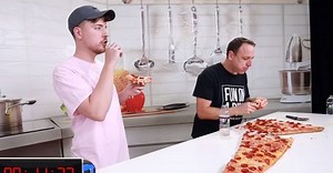Popular YouTuber eats world's largest pizza slice while challenging professional eater, gets defeated