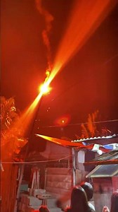 Flare sparks small fire during New Year celebration in Cavite, Philippines