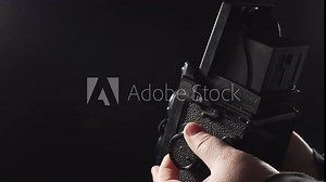 old camera on dark background - load the shutter and take photographs with a vintage camera