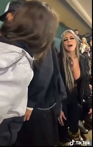 Woman Flashes her t*ts in a stadium. Mother gets mad as her kids saw the t*ts. Crowed throws beer on mad mother.