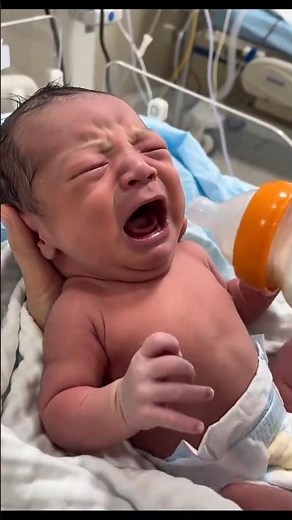 Hungry Newborn Baby Bottle Feeding in the Hospital