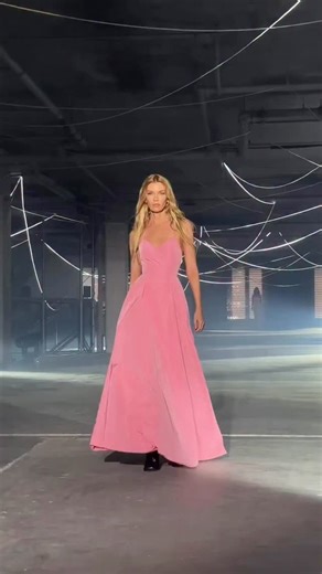 The spring Vetements display on Friday afternoon took place in a raw concrete space strung with job-site string lights. It opened with the sound of barking dogs, strobe lights, and the sight of masked models wearing T-shirts bearing swastikas covered with the red ‘No’ symbol. It closed with a model wearing a bulging black dress and weeping her eyes out. Yeesh! Thankfully, in between were some fun clubwear paraded to slick techno, including skinny jeans, fierce leather coats with face-swallowing 