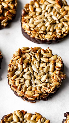 Nadia Al-Khaffaf on Instagram: "If you’re looking for an easy crunchy snack that’s also good for you, try these 4-ingredient sunflower seed chocolate bites. All you need is sunflower seeds, maple syrup, salt and dark chocolate! Click the link in my bio to take you straight to the recipe + nutritional breakdown 🥰✨ Nadia xx #healthysnacks #healthyrecipes #healthydessert #crunchy #sunflowerseeds #easysnack #easydessert #darkchocolate #4ingredients #dairyfreerecipes #glutenfreerecipes"