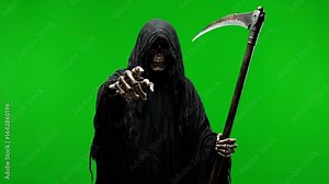 Grim Reaper Pointing Accusatorily on Green Screen - A grim reaper figure, cloaked in black, holds a large scythe while extending a bony finger towards the viewer.