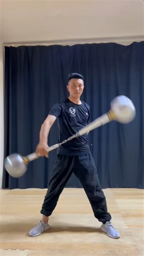 Not your average nunchucks.🔥 Master Yuan Yonghui expertly wields an 8-kilogram two-section hammer — a chained weapon with hammers instead of sticks — moving with flawless flow, exceptional control, and incredible power. #SkillsOnPoint #martialarts #wushu #kungfu #kungfulife #brucelee #weapon #training #TBT #ChallengeAccepted #master | All about Martial Arts